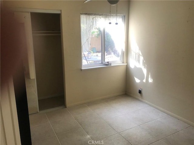 2710 Castle Rock Rd, Diamond Bar, CA 91765 - unfurnished bedroom with tile patterned flooring and a closet