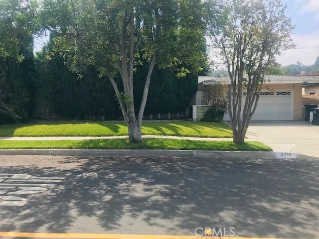 2710 Castle Rock Rd, Diamond Bar, CA 91765 - view of front facade with concrete driveway, a front yard, and a garage