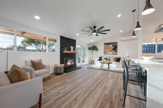 3356 Lockwood Dr, San Diego, CA 92123 - living room featuring light wood-type flooring, vaulted ceiling, ceiling fan, a fireplace, and recessed lighting