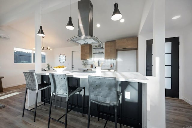 3356 Lockwood Dr, San Diego, CA 92123 - kitchen featuring island range hood, brown cabinets, light countertops, wood finished floors, and a wall mounted air conditioner