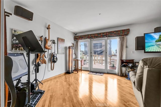 16745 Bayview Dr Unit B, Sunset Beach, CA 90742 - workout room featuring wood finished floors and baseboards