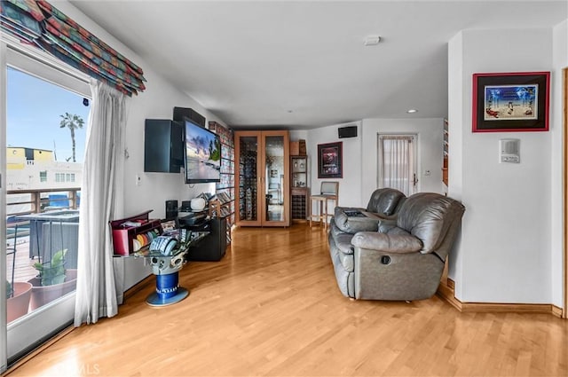 16745 Bayview Dr Unit B, Sunset Beach, CA 90742 - living area featuring wood finished floors and baseboards