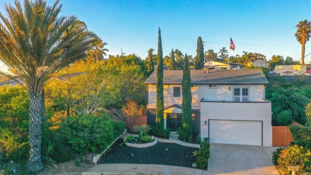 1682 Saddlehorn Dr, San Marcos, CA 92069 - view of front of home featuring concrete driveway, stucco siding, and an attached garage