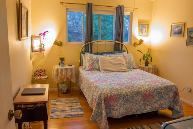 1682 Saddlehorn Dr, San Marcos, CA 92069 - bedroom featuring baseboards and wood finished floors