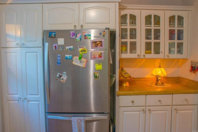 1682 Saddlehorn Dr, San Marcos, CA 92069 - kitchen with freestanding refrigerator, glass insert cabinets, and white cabinetry