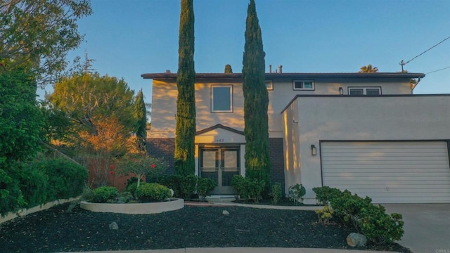1682 Saddlehorn Dr, San Marcos, CA 92069 - view of front of house featuring stucco siding, concrete driveway, and an attached garage