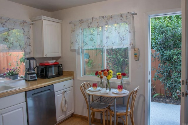 1682 Saddlehorn Dr, San Marcos, CA 92069 - kitchen featuring dishwasher, black microwave, white cabinetry, and light countertops