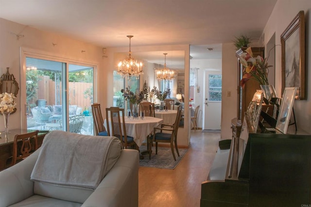 1682 Saddlehorn Dr, San Marcos, CA 92069 - dining room with a chandelier and light wood-style flooring
