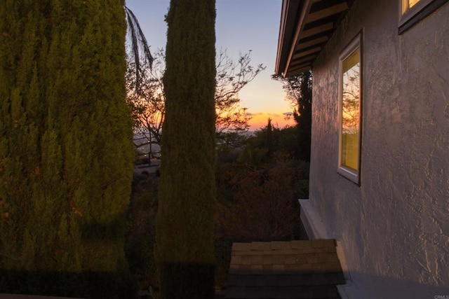 1682 Saddlehorn Dr, San Marcos, CA 92069 - property exterior at dusk with stucco siding