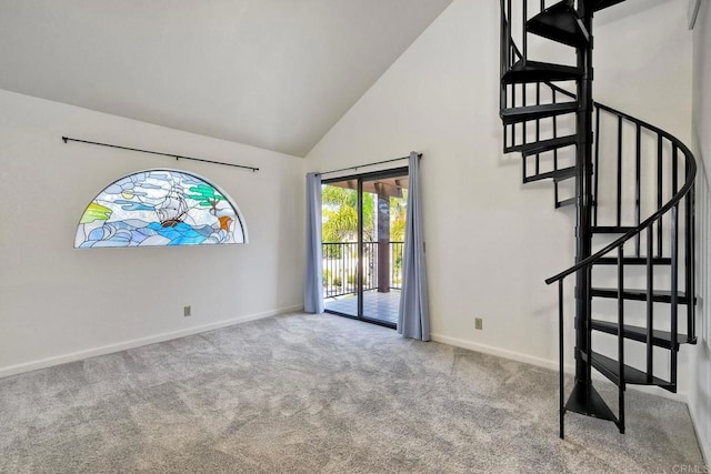 4015 Canario St Unit E, Carlsbad, CA 92008 - unfurnished room with high vaulted ceiling, carpet flooring, and stairs