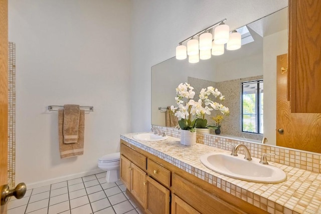 4015 Canario St Unit E, Carlsbad, CA 92008 - full bath with tile patterned flooring, double vanity, and decorative backsplash