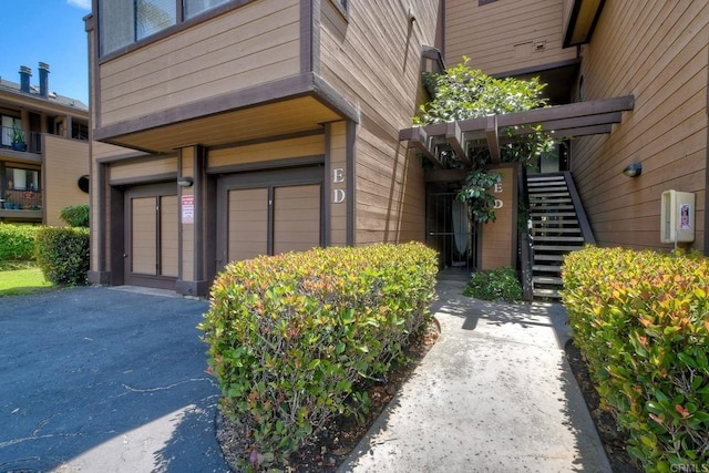 4015 Canario St Unit E, Carlsbad, CA 92008 - entrance to property featuring a garage and asphalt driveway
