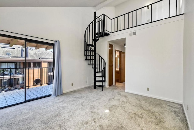 4015 Canario St Unit E, Carlsbad, CA 92008 - unfurnished room with carpet, high vaulted ceiling, and stairway