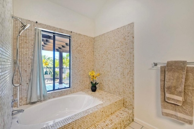 4015 Canario St Unit E, Carlsbad, CA 92008 - bathroom with a relaxing tiled tub and tile patterned floors