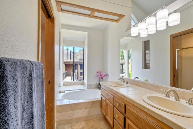 4015 Canario St Unit E, Carlsbad, CA 92008 - bathroom with double vanity, a bath, a stall shower, and tile patterned floors