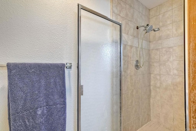 4015 Canario St Unit E, Carlsbad, CA 92008 - bathroom featuring a stall shower and a textured wall