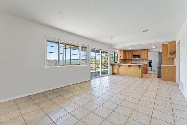 6174 Syracuse Way, San Diego, CA 92122 - unfurnished living room with light tile patterned flooring and recessed lighting