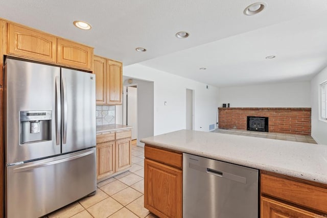 6174 Syracuse Way, San Diego, CA 92122 - kitchen featuring stainless steel appliances, tasteful backsplash, light tile patterned floors, recessed lighting, and light stone counters