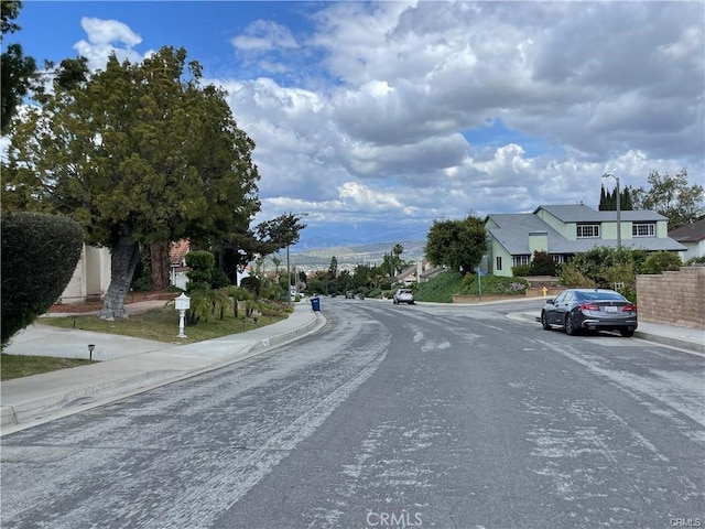 16413 Abascal Dr, Hacienda Heights, CA 91745 - view of asphalt road with sidewalks, curbs, and street lights