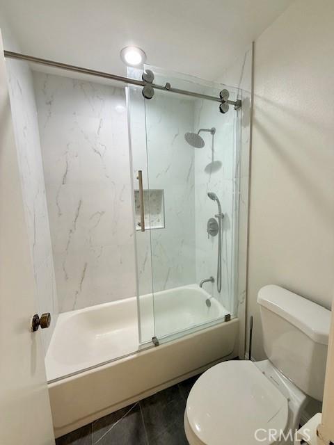 16413 Abascal Dr, Hacienda Heights, CA 91745 - bathroom featuring shower / bath combination with glass door and toilet