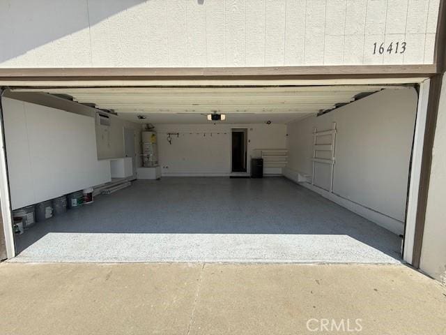16413 Abascal Dr, Hacienda Heights, CA 91745 - garage featuring strapped water heater and a garage door opener
