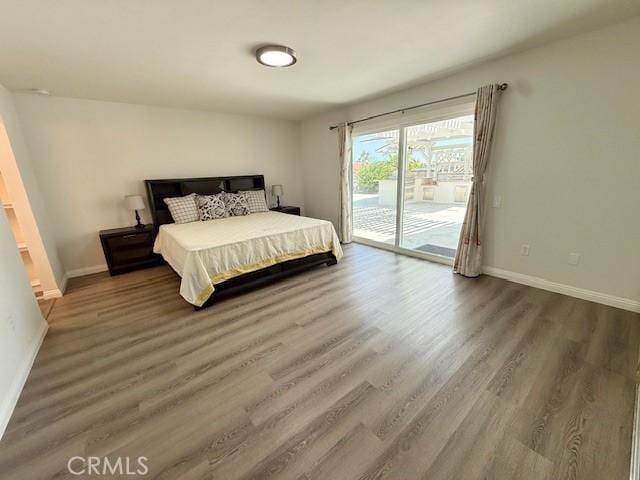 16413 Abascal Dr, Hacienda Heights, CA 91745 - bedroom with access to exterior and wood finished floors