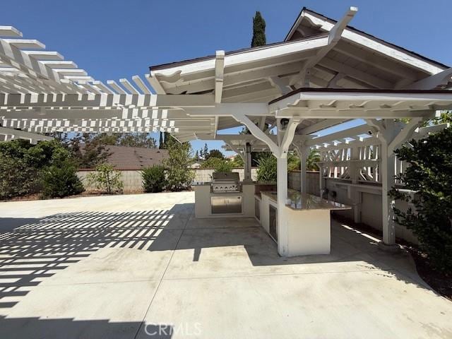 16413 Abascal Dr, Hacienda Heights, CA 91745 - view of patio / terrace with an outdoor kitchen and a pergola