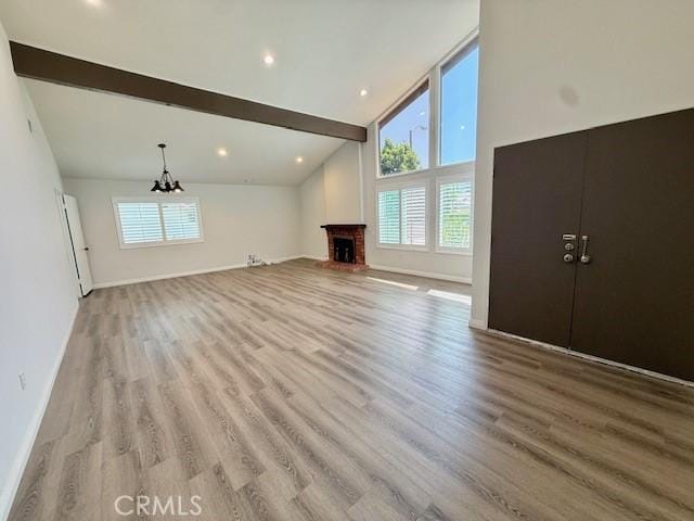 16413 Abascal Dr, Hacienda Heights, CA 91745 - unfurnished living room featuring a chandelier, plenty of natural light, and wood finished floors