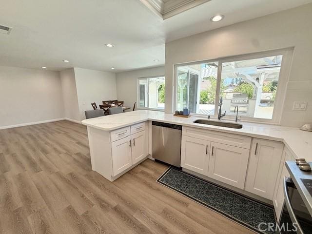 16413 Abascal Dr, Hacienda Heights, CA 91745 - kitchen featuring stainless steel dishwasher, recessed lighting, light wood-style floors, a peninsula, and white cabinetry