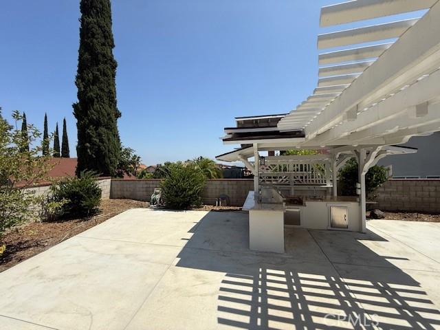 16413 Abascal Dr, Hacienda Heights, CA 91745 - fenced backyard with an outdoor kitchen and a patio
