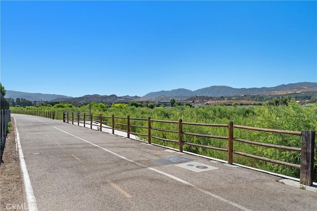 27074 Hidaway Ave Unit 3, Canyon Country, CA 91351 - view of parking with a mountain view and a rural view