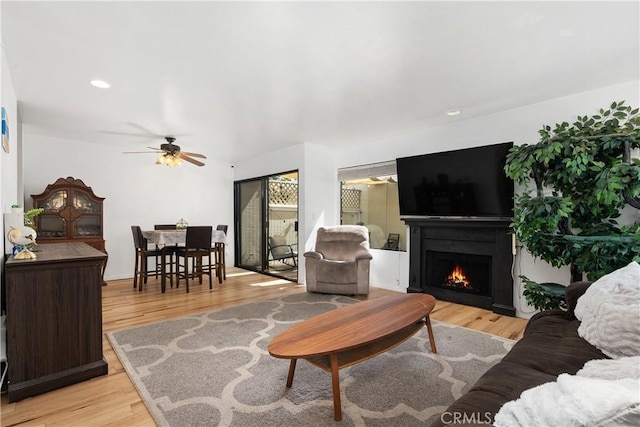 27074 Hidaway Ave Unit 3, Canyon Country, CA 91351 - living area with a ceiling fan, light wood-style flooring, a lit fireplace, and recessed lighting