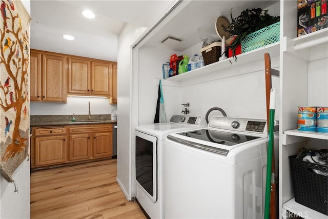 27074 Hidaway Ave Unit 3, Canyon Country, CA 91351 - laundry room featuring washing machine and dryer, light wood finished floors, and recessed lighting