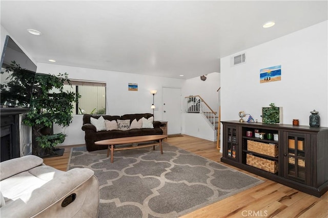 27074 Hidaway Ave Unit 3, Canyon Country, CA 91351 - living area featuring stairs, wood finished floors, and recessed lighting