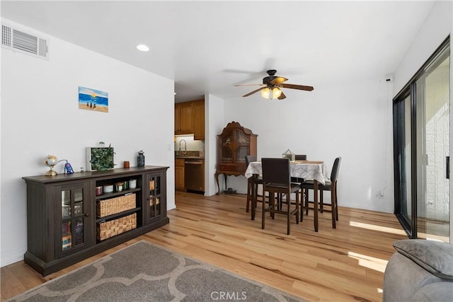 27074 Hidaway Ave Unit 3, Canyon Country, CA 91351 - dining room featuring light wood finished floors, a ceiling fan, and recessed lighting