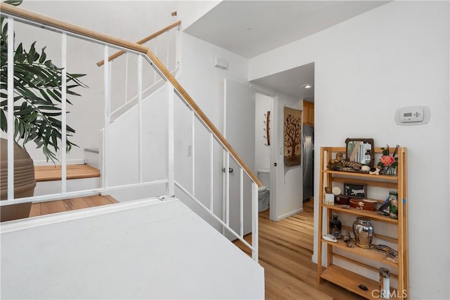27074 Hidaway Ave Unit 3, Canyon Country, CA 91351 - stairs featuring wood finished floors