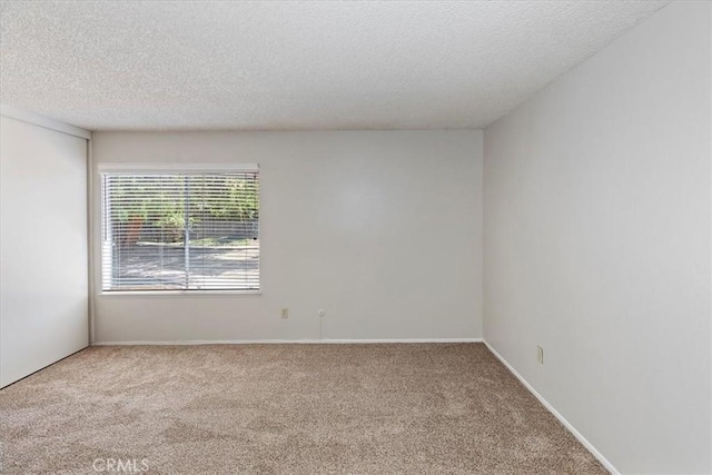 1897 Taylor Ave, Corona, CA 92882 - spare room featuring carpet and a textured ceiling