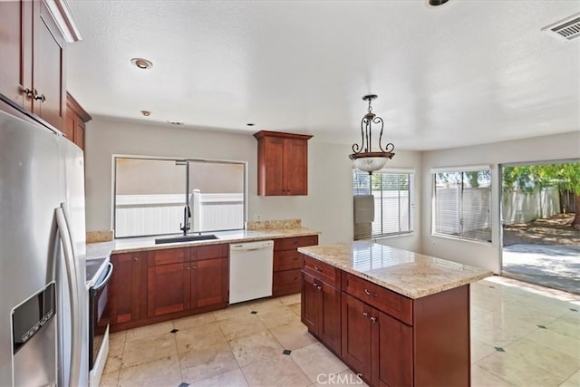 1897 Taylor Ave, Corona, CA 92882 - kitchen featuring white dishwasher, stainless steel refrigerator with ice dispenser, range with electric stovetop, a center island, and light stone counters