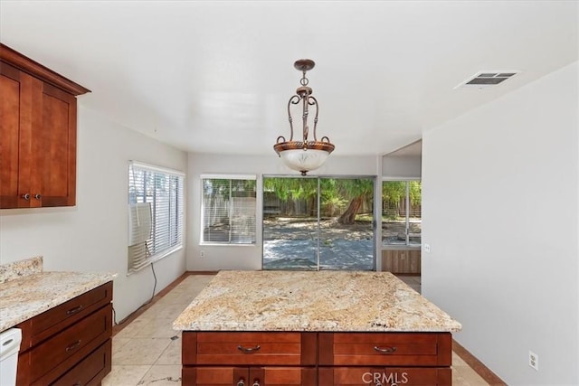 1897 Taylor Ave, Corona, CA 92882 - kitchen with light stone counters, hanging light fixtures, white dishwasher, and a kitchen island