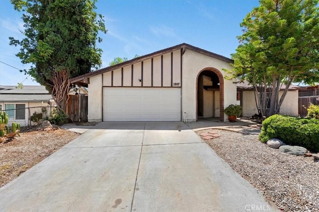 1897 Taylor Ave, Corona, CA 92882 - ranch-style home featuring a garage, concrete driveway, and board and batten siding