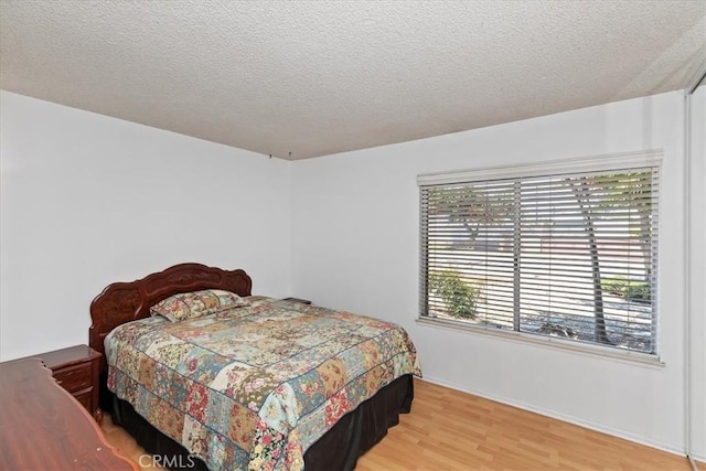 1897 Taylor Ave, Corona, CA 92882 - bedroom featuring wood finished floors and a textured ceiling