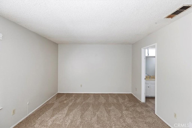 1897 Taylor Ave, Corona, CA 92882 - spare room with a textured ceiling and carpet