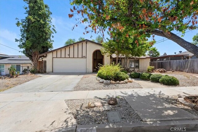 1897 Taylor Ave, Corona, CA 92882 - ranch-style home featuring a garage, driveway, stucco siding, and board and batten siding