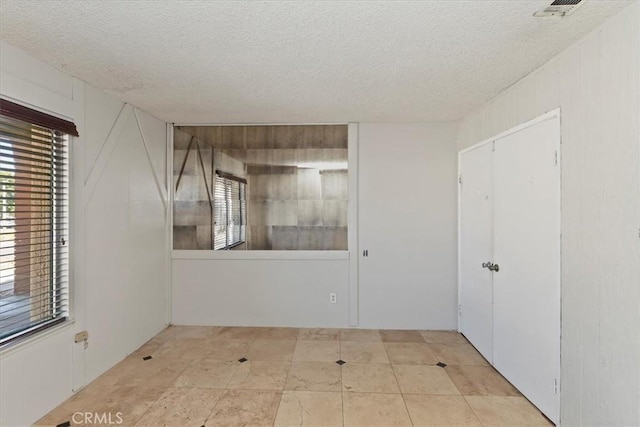 1897 Taylor Ave, Corona, CA 92882 - empty room with a textured ceiling