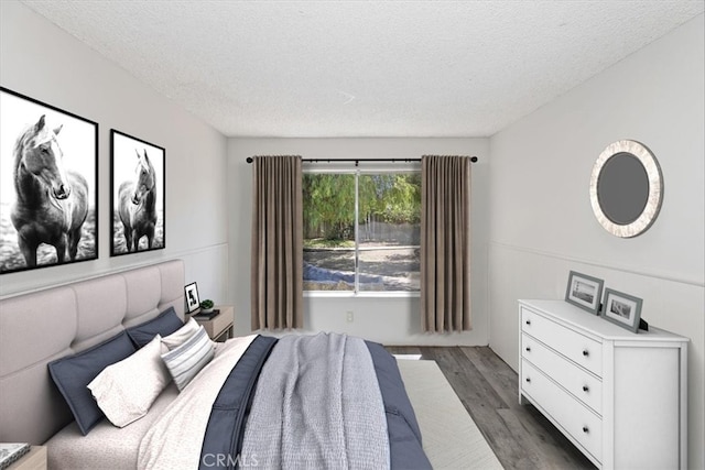 1897 Taylor Ave, Corona, CA 92882 - bedroom with dark wood-style floors and a textured ceiling