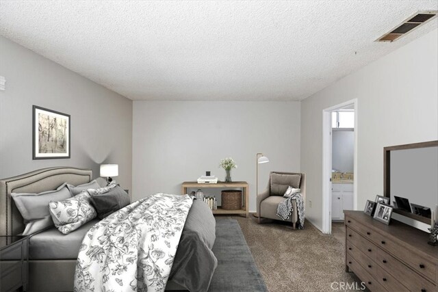 1897 Taylor Ave, Corona, CA 92882 - carpeted bedroom featuring a textured ceiling and ensuite bath