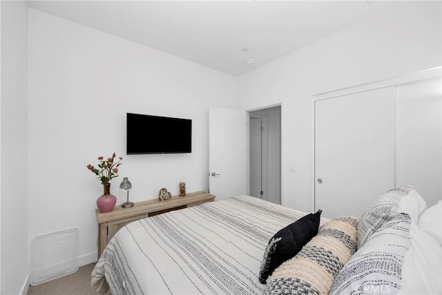 9958 Artesia Blvd Unit 1003, Bellflower, CA 90706 - carpeted bedroom featuring a closet and baseboards