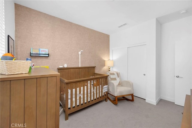 9958 Artesia Blvd Unit 1003, Bellflower, CA 90706 - carpeted bedroom featuring a crib and a closet