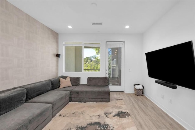 9958 Artesia Blvd Unit 1003, Bellflower, CA 90706 - living room featuring wood finished floors, recessed lighting, and tile walls