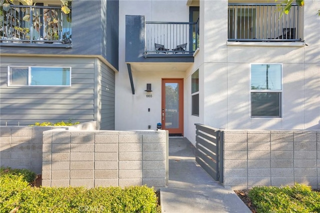 9958 Artesia Blvd Unit 1003, Bellflower, CA 90706 - entrance to property with a balcony and stucco siding
